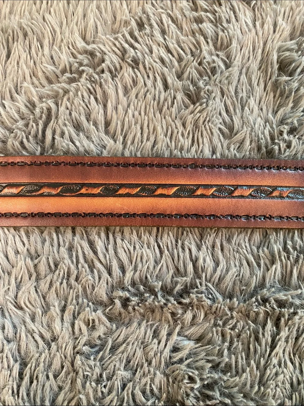 Vintage brown tooled leather belt 47” long 1.5” wide brass
